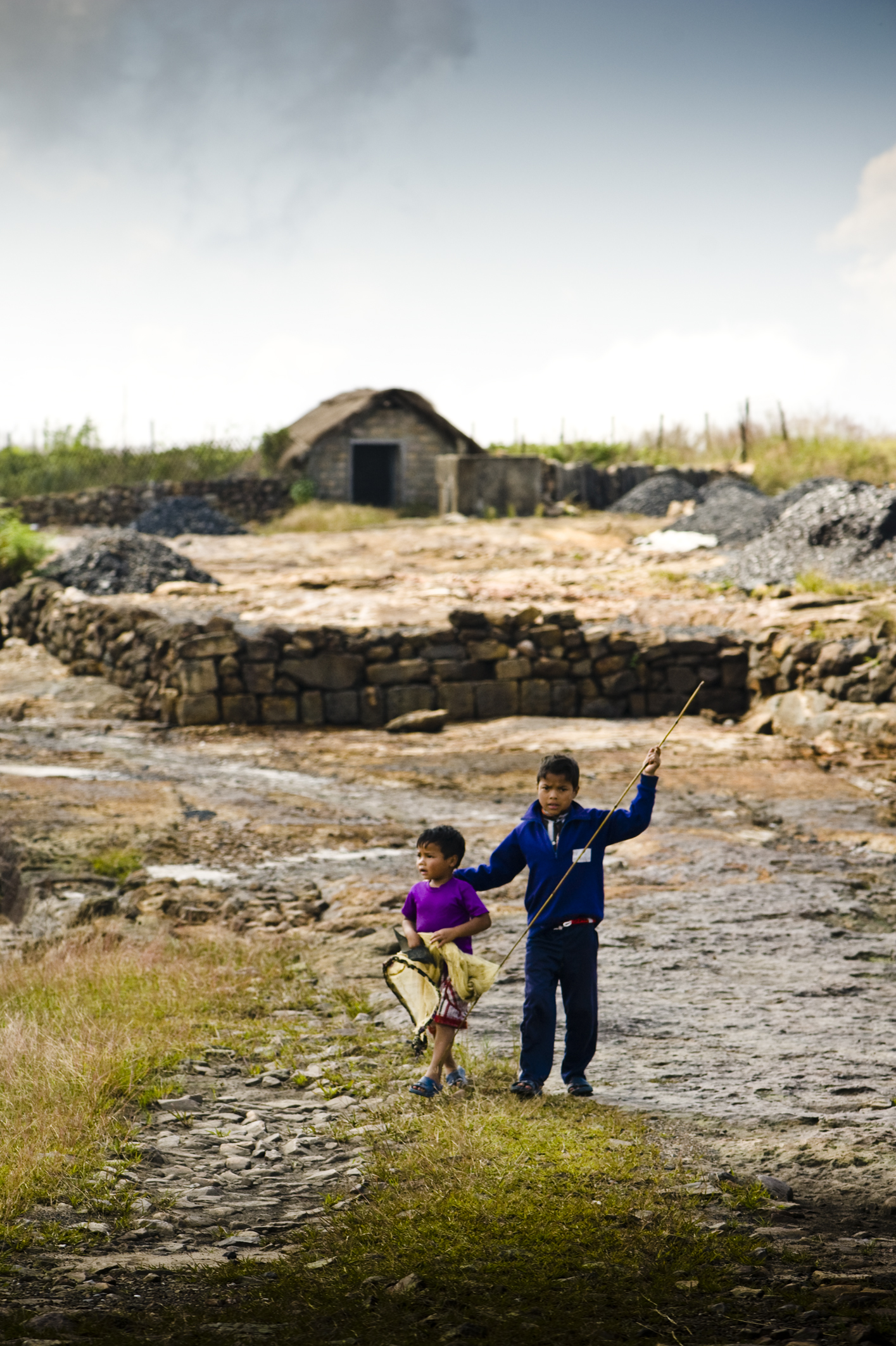 Children carrying fishing nets - On the coal belt of Meghalaya