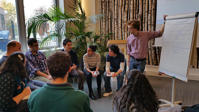 Henri facilitates a group discussion.