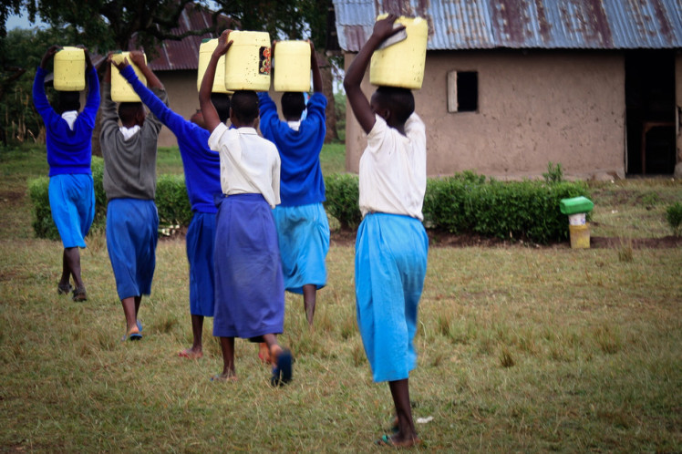 Carrying water in rural Kenya. Bethany Caruso, Author provided
